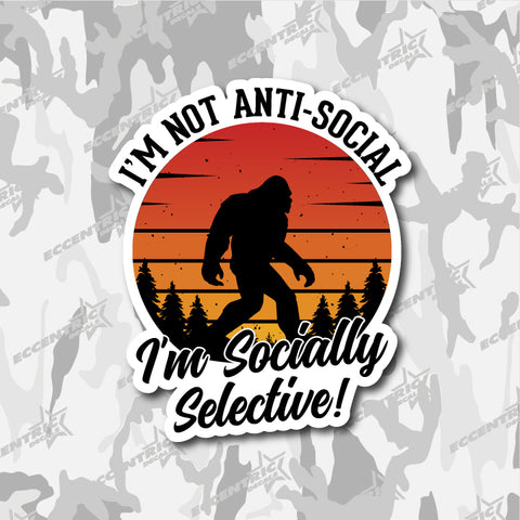 I'm Not Anti-social, I'm Socially Selective — an Eccentric Stickers design: Bigfoot walking across a retro orange sunset behind pine trees